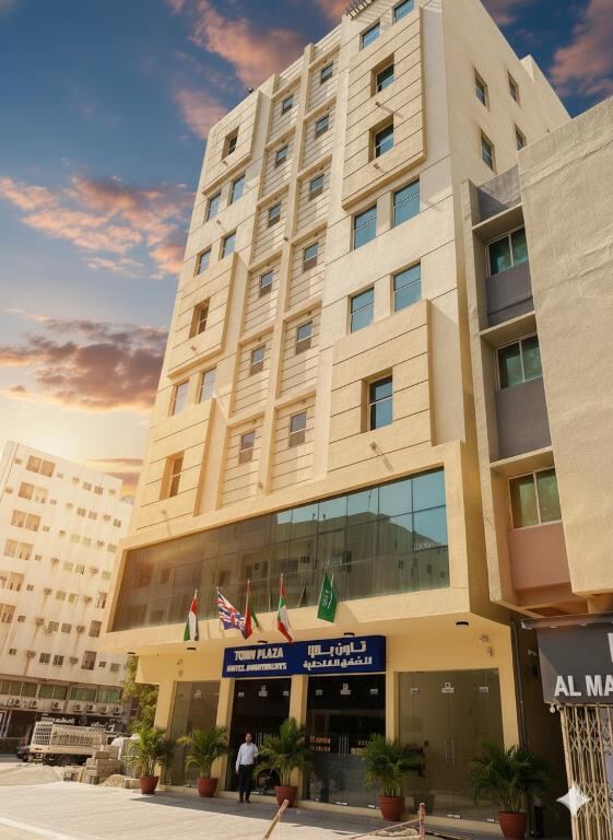 Town Plaza Hotel Apartments Ras Al Khaimah building exterior at sunset