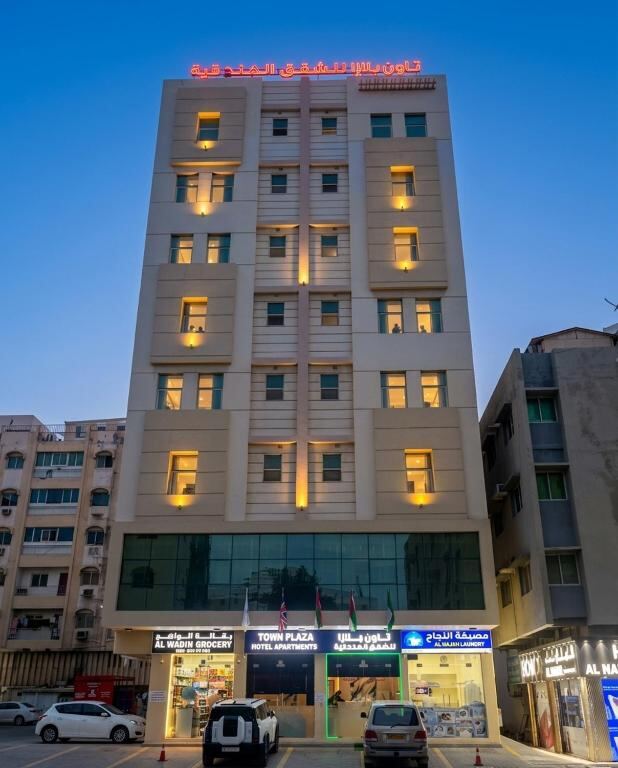 Town Plaza Hotel Apartments Ras Al Khaimah illuminated at dusk